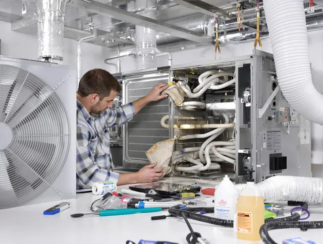 Stoneham Air Duct Cleaning specialist performing precision AC coil cleaning in Stoneham