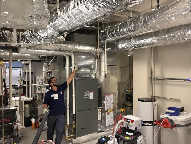 Stoneham Air Duct Cleaning specialist performing thorough furnace duct cleaning in a Stoneham residence