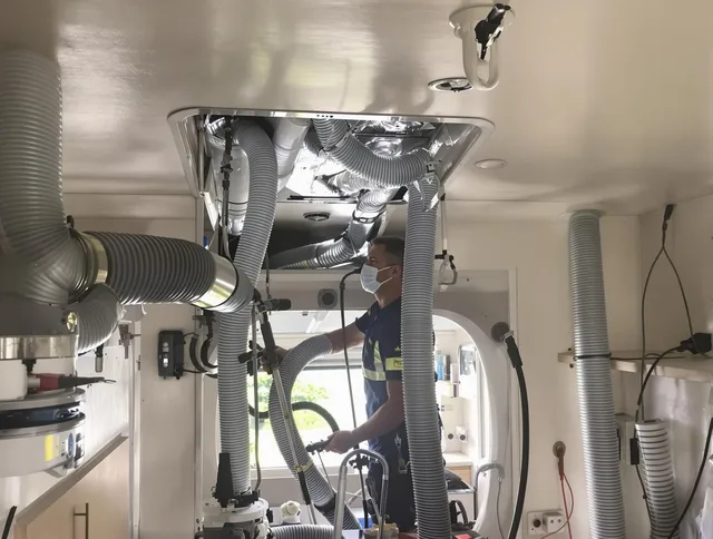 Stoneham Air Duct Cleaning specialist performing precise mobile home duct cleaning in Stoneham