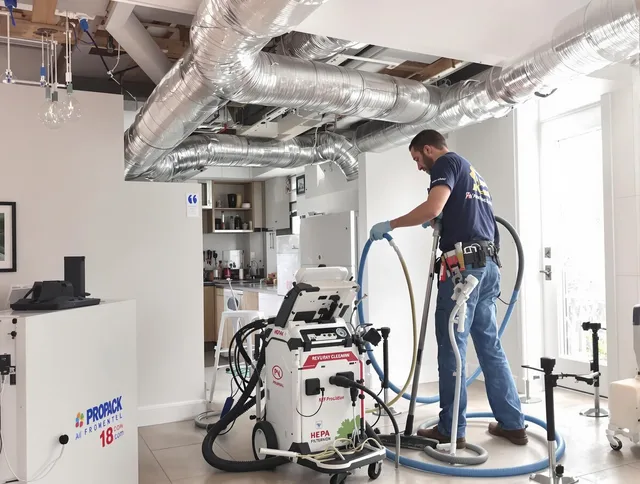 Stoneham Air Duct Cleaning technician performing advanced pure duct cleaning with specialized equipment in Stoneham